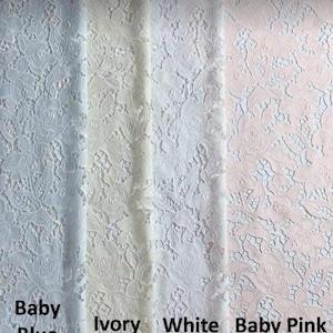 May include: Close-up of four fabric swatches in baby blue, ivory, white, and baby pink. The lace fabric features a floral pattern. The colors are labeled with text: Baby Blue, Ivory, White, and Baby Pink.