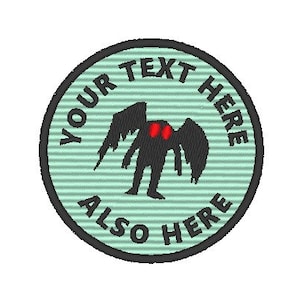 May include: A green and black circular patch with the text "YOUR TEXT HERE ALSO HERE" around the edge. In the center is a black silhouette of a creature with large red eyes and wings.