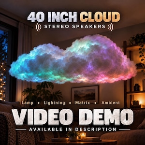May include: A 40 inch cloud-shaped light fixture featuring integrated stereo speakers. The cloud emits a multi-colored glow with shades of blue, purple, and pink. Text on the image reads 40 INCH CLOUD STEREO SPEAKERS, Lamp, Lightning, Matrix, Ambient, and VIDEO DEMO AVAILABLE IN DESCRIPTION.