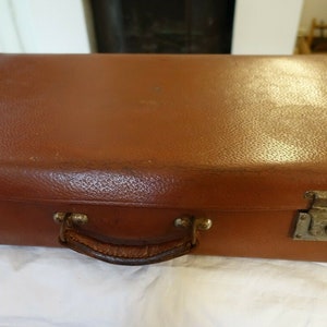 old leather suitcase car trunk vintage