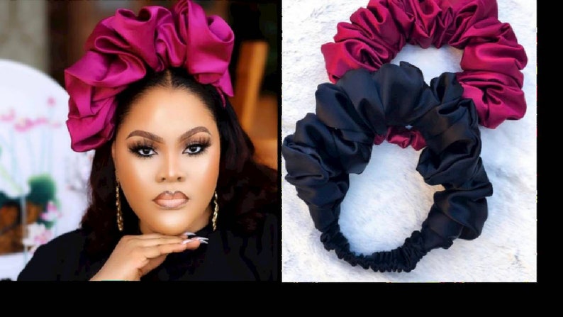 May include: Two satin headbands, one in a deep burgundy color and the other in black. Both headbands are made of soft, gathered fabric and are designed to be worn around the head.