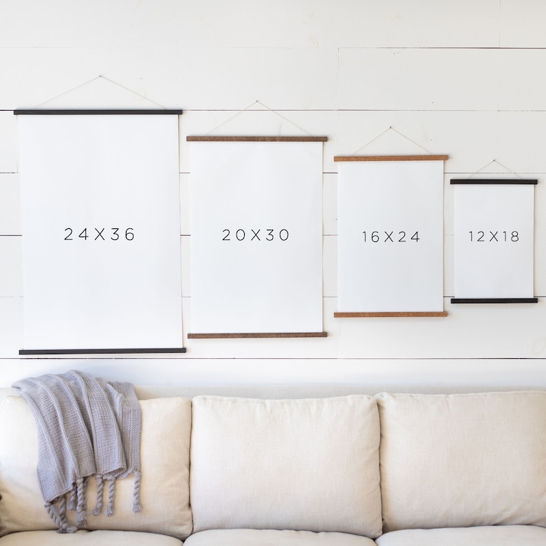 May include: Four different sizes of canvas prints with black frames, hanging on a white wall. The prints are labeled with their dimensions: 24x36, 20x30, 16x24, and 12x18.