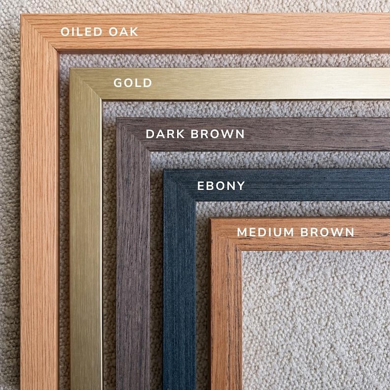 a collection of different colored wooden frames, each with a label indicating the color, such as "OILED OAK", "GOLD", "DARK BROWN", "EBONY", and "MEDIUM BROWN".