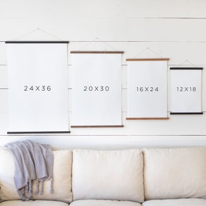 May include: Four different sizes of canvas prints with black frames, hanging on a white wall. The prints are labeled with their dimensions: 24x36, 20x30, 16x24, and 12x18.