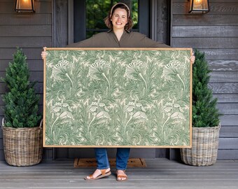 May include: A large rectangular wall art piece featuring a repeating botanical pattern of green stylized flowers and foliage on a cream background, encased in a simple light-toned wooden frame with clean edges and a smooth finish.