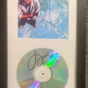 CD incorniciato firmato da Jimmy Buffett con copertina CD 12x7 Somewhere Over China