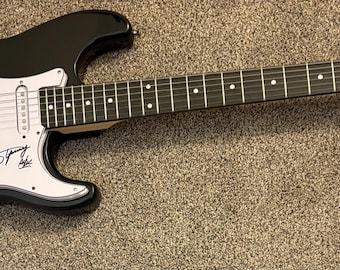 Angus Young AC/DC Signed Electric Black Strat- style Guitar