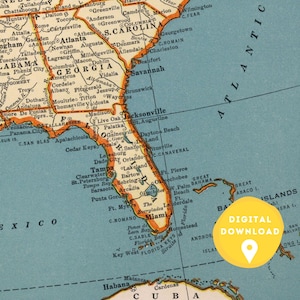 May include: A vintage map of the southeastern United States, showing the states of Florida, Georgia, Alabama, South Carolina, and North Carolina. The map is printed on blue paper with orange and yellow accents. The map includes major cities and towns, rivers, and bodies of water. The map also includes a yellow circle with the text "DIGITAL DOWNLOAD" in black.