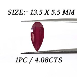 May include: A deep red pear-shaped gemstone, measuring 13.5 x 5.5 mm, weighing 4.08 carats.  SIZE:- 13.5 X 5.5 MM 1PC / 4.08CTS
