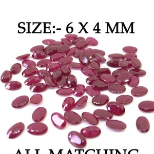 Puede incluir: Un conjunto de gemas ovaladas de color rojo intenso. El texto de la imagen dice "SIZE:- 6 X 4 MM" y "ALL MATCHING". Estas gemas son adecuadas para la creación de joyas y manualidades.
