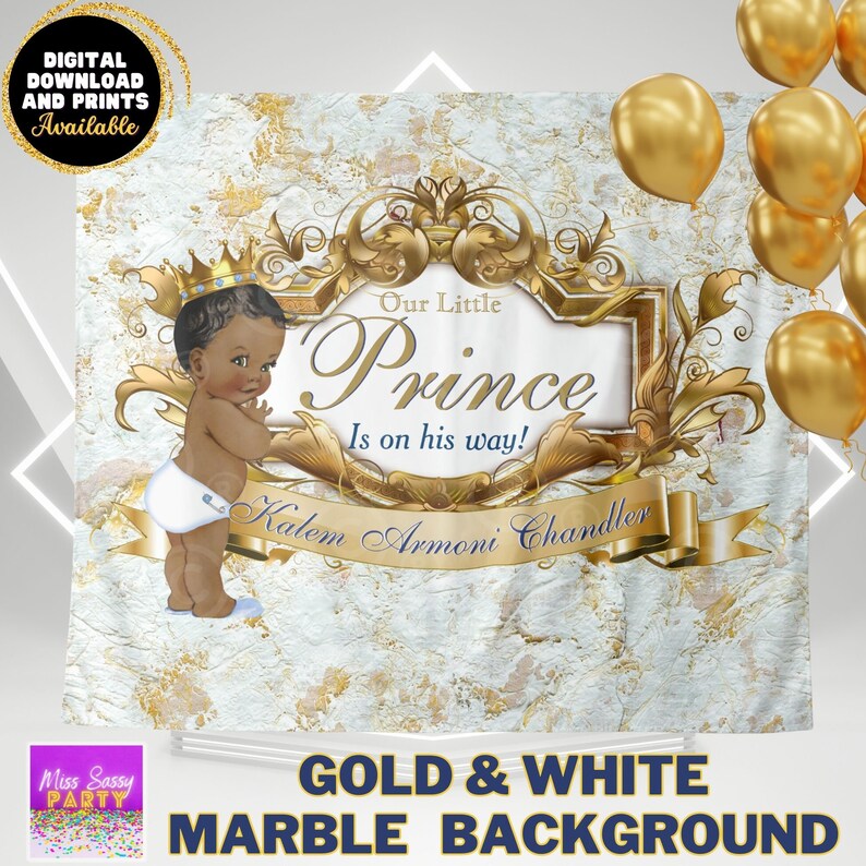 May include: A white and gold marble backdrop with a gold crown and banner. The banner reads "Our Little Prince Is on his way! Kalem Armoni Chandler".