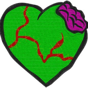 May include: A green heart-shaped patch with red veins and yellow stitches. A black border surrounds the heart. A purple and black design is on the upper right side of the heart.
