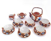 Japanese Satsuma egg porcelain tea set, teapot and four cups and saucers. 1930-40 Mid-century.
