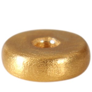 May include: A gold-colored metal bead with a round shape and a hole in the center. The bead has a textured surface.