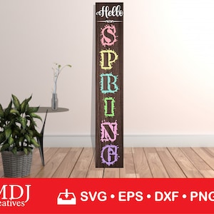 May include: A wooden sign with the word "Hello" and the word "Spring" spelled out vertically with each letter in a different pastel color. The sign is on a white wall with a plant in a wicker basket and a vase with dried flowers on a table.