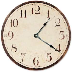 May include: A round wall clock with a cream-colored face and dark brown, distressed-style numerals from 1 to 12. The clock features a dark brown outer rim, black metal hour and minute hands, and small decorative markings at the 15, 30, 45, and 60-minute positions.