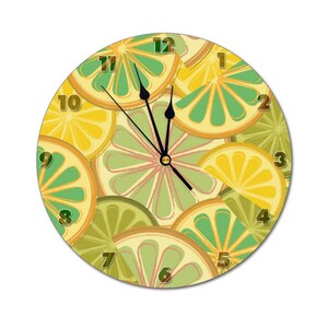 May include: A round clock with a lime and lemon design. The clock face is white with black numbers and hands. The background is a pattern of lime and lemon slices.