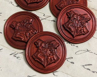 May include: Five red wax seals with a raised design of a coat of arms. The coat of arms features a lion, an eagle, a badger, and a snake.