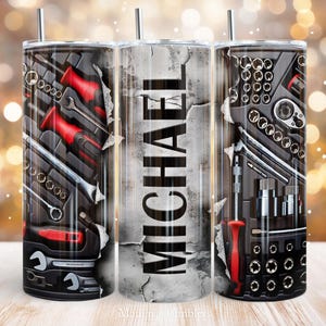 May include: A stainless steel tumbler with a straw, featuring a design of a toolbox with wrenches, screwdrivers, and sockets. The name "MICHAEL" is printed vertically on the tumbler. The design has a distressed, weathered look.