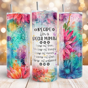 May include: A colorful tumbler with a watercolor floral design and the text "*RECIPE for a SPECIAL MAMAW*** I cup of love. 3/4 cup of hugs I cup of kisses I scoop of fun Itbsp. of patience***"