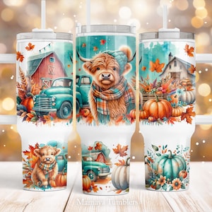 May include: Three stainless steel tumblers with lids and handles. Each tumbler features a different autumn-themed design with a highland cow, a vintage truck, pumpkins, and fall leaves. The tumblers are white with a watercolor-like background.