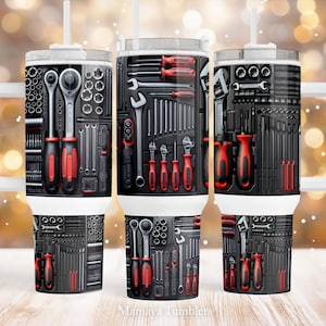 May include: Three stainless steel tumblers with a black and red design featuring a variety of tools, including spanners, screwdrivers, and sockets. The tumblers have a lid and a straw.