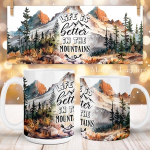 May include: White ceramic mug with a watercolor mountain scene and the text "LIFE IS better IN THE MOUNTAINS".