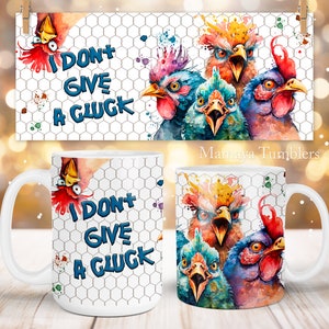 May include: White ceramic mug with a colorful watercolor illustration of chickens with the text "I don't give a cluck" on a white background with a chicken wire pattern.