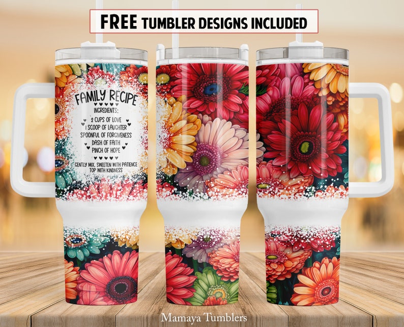 May include: White stainless steel tumbler with a floral design and the text "FAMILY RECIPE" and a list of ingredients. The tumbler has a handle and a lid.