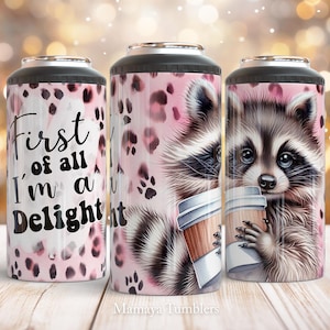 May include: A pink and white tumbler featuring a raccoon design and the text "First of all I'm a Delight".