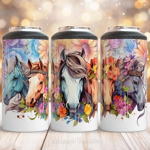 May include: Three stainless steel tumblers with colorful floral designs and images of horses wearing flower crowns. The tumblers are white with a black lid.