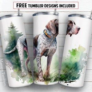 May include: Three stainless steel tumblers with a watercolor design featuring a German Shorthaired Pointer dog. The tumblers have a white background with green and brown watercolor accents. The dog is depicted in a hunting scene with a forest background. The text "Mamaya Tumblers" is printed on one of the tumblers.