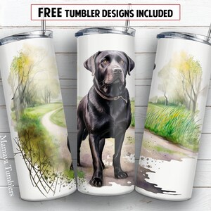 May include: A black Labrador Retriever dog stands on a path in a watercolor landscape. The dog is looking directly at the viewer. The image is on a white tumbler with a silver lid and straw. The tumbler has the text "Mamaya Tumblers" on the side.