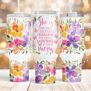 May include: White stainless steel tumbler with a pink floral design and the text "She is strong, selfless, fearless, patient, loving, warm mom".