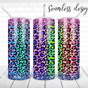 May include: Three stainless steel tumblers with a rainbow ombre leopard print design and glitter accents. The tumblers are all the same size and have a straw in each.