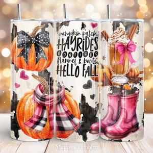 May include: Three stainless steel tumblers with fall-themed designs. The first tumbler features a pumpkin with a black and white polka dot bow, the second tumbler features the text "pumpkin patch hayrides bonfires flannel & boots hello fall", and the third tumbler features a cup of hot chocolate with whipped cream and a pink bow, and pink boots.