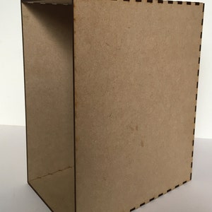 May include: A brown cardboard box with a decorative black and white border. The box is empty and has a rectangular shape.