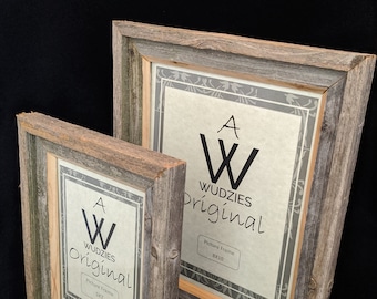 May include: Two rustic wooden picture frames. The frames are made of weathered gray wood with a natural wood-tone inner border. The frames have the text "WUDZIES Original" and the sizes 5x7 and 8x10.