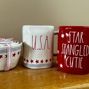 Rae Dunn Summer “U.S.A." and "Star Spangled Cutie" coffee mugs. Independence Day measuring cups- 4th of July