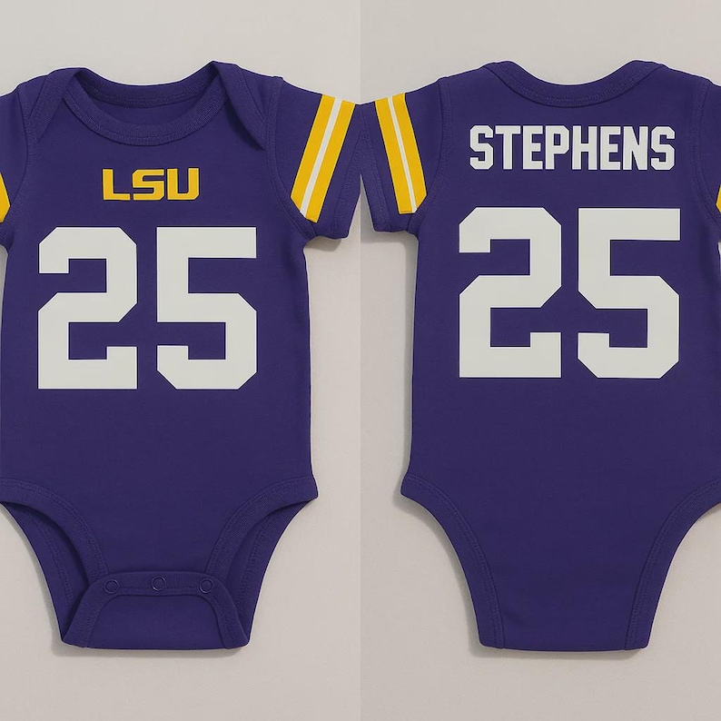 A purple baby bodysuit with yellow and white accents. The front displays 'LSU' in yellow letters above the number '25' in white. The back of the bodysuit features the name 'STEPHENS' in white above the number '25' in white.