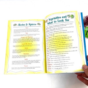 May include: A yellow and green illustrated book page with the title "Herbs & Spices" and "Vegetables and What to Look For". The page lists common herbs and spices with descriptions of their uses and flavors, as well as a list of vegetables with descriptions of what to look for when selecting them.