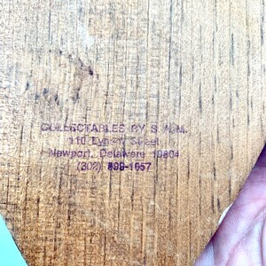 May include: A wooden plaque with the text "COLLECTABLES BY S.A.M. 110  Everett Street Newport, Delaware 19804 (302) #991-1657" printed on it.