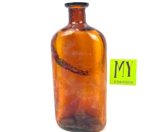 Antique Amber Glass Medicine Bottle: Embossed Collectible