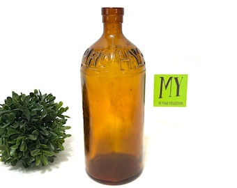 Antique Amber Brown Glass Bottle: HY-PRO Embossed Round Bottle