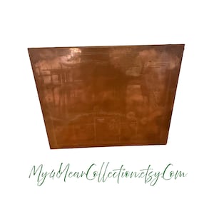 May include: A copper-colored, rectangular planter with a slightly trapezoidal shape. The surface has a patina and etched details, possibly depicting a map or architectural elements. The text "My4YearCollection.etsy.com" is at the bottom.