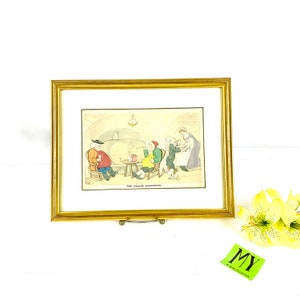 Peut inclure: Une estampe encadrée d'une illustration vintage représentant un groupe de personnes dans un sous-sol. L'illustration est intitulée "The Cellar Quartette" et représente quatre personnes assises autour d'une table, avec une personne debout qui verse une boisson. L'estampe est encadrée dans un cadre doré.