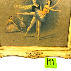 May include: A framed vintage print of a ballet performance. The print features a male and female dancer in mid-pose, with two other dancers in the background. The print is signed "Gime" in the bottom left corner.