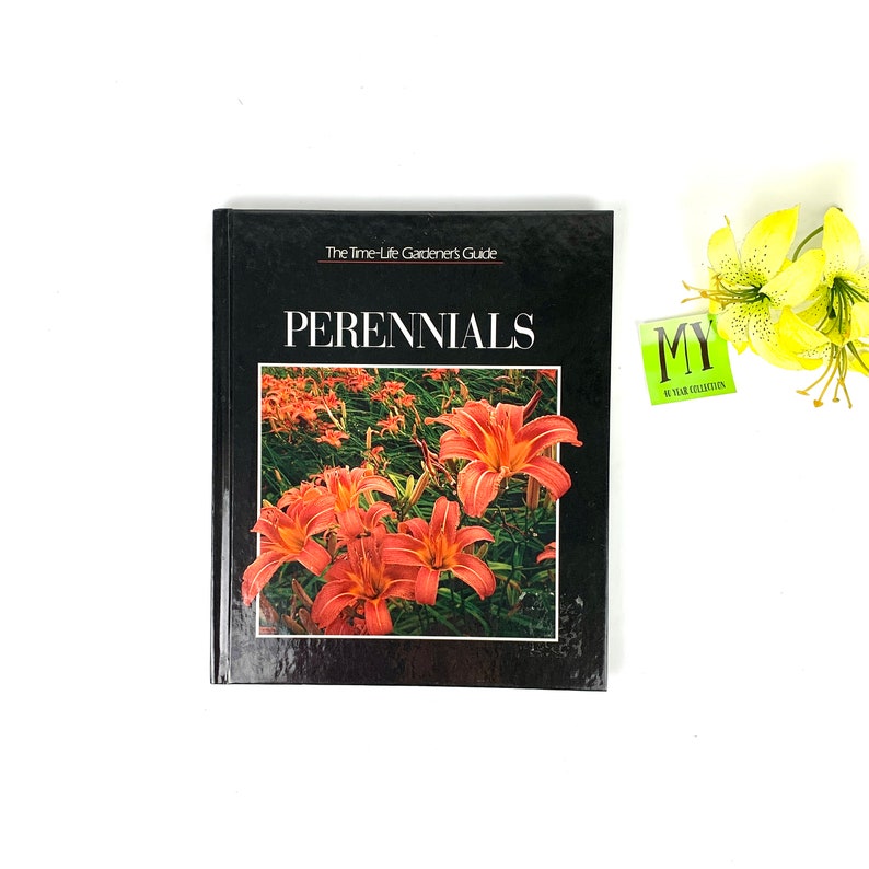 May include: A black book with the title "The Time-Life Gardener's Guide: Perennials" and a photo of orange lilies on the cover.