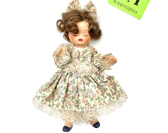 Vintage Bisque Doll: Brown Curly Hair, Floral Lace Dress