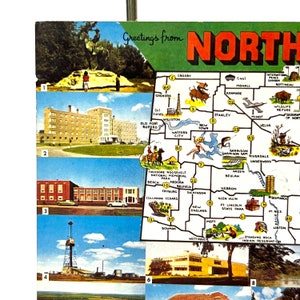May include: A vintage postcard featuring a map of North Dakota with various cities and towns highlighted. The postcard includes a green border with the text "Greetings from North Dakota".